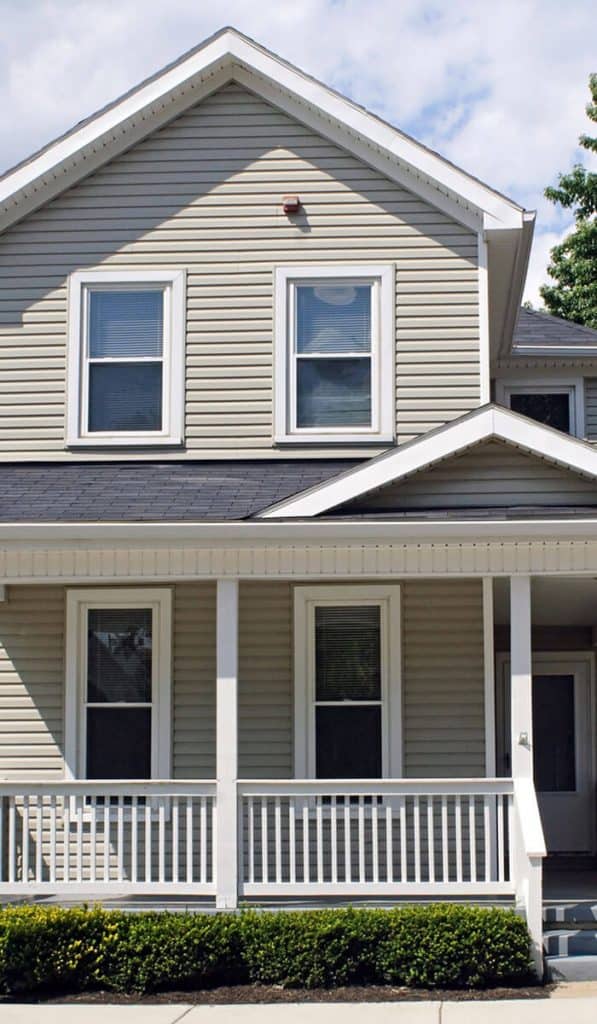 Urbandale Two-Story Residential House with white siding and a dark grey roof